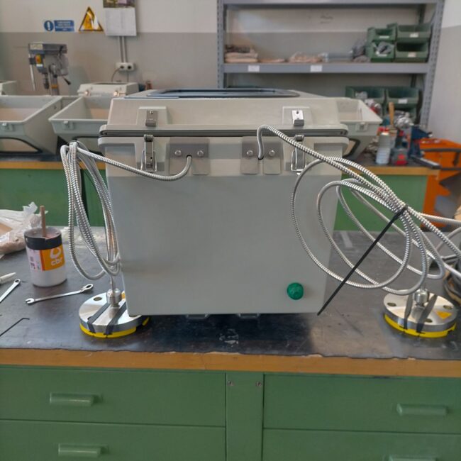 GRP enclosure with capillaries